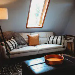 Small loft space with chair, lamp, and table in a Fairbanks Alaska vacation rental