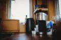 Coffee maker, kettle, and cups on wooden counter in a Fairbanks Alaska treehouse kitchen