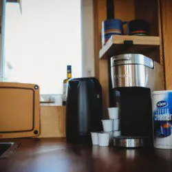 Coffee maker, kettle, and cups on wooden counter in a Fairbanks Alaska treehouse kitchen
