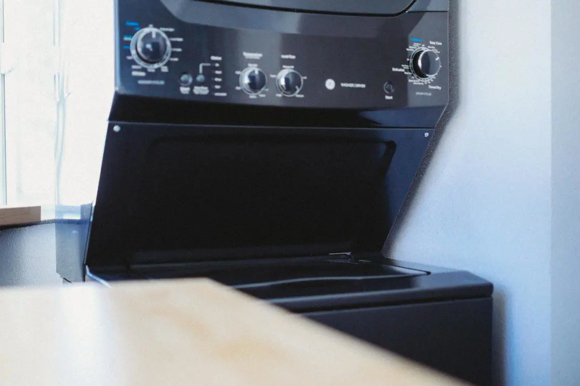 Stacked washer and dryer unit in modern Fairbanks Alaska treehouse rental