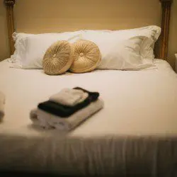 Cozy lodge bedroom in Fairbanks Alaska with elegant decor and natural light, ideal for weddings or unique stays