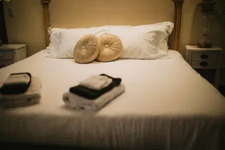 Cozy lodge bedroom in Fairbanks Alaska with elegant decor and natural light, ideal for weddings or unique stays