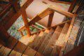 Wooden staircase leading down from a treehouse in Fairbanks, Alaska