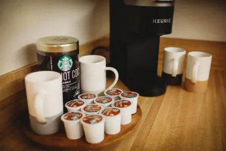 Keurig coffee setup with Starbucks hot cocoa, mugs, and K-cups in a Fairbanks Alaska vacation rental kitchen