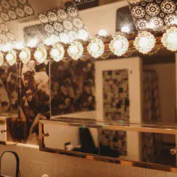 Black soaking bathtub with tiled backsplash in a Fairbanks Alaska treehouse bathroom