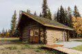 Log cabin with hot tub and grill in a wooded Fairbanks Alaska setting