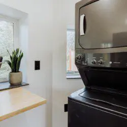 Sleek kitchen with light wood counters, gray cabinets, stainless steel appliances in a Fairbanks Alaska rental