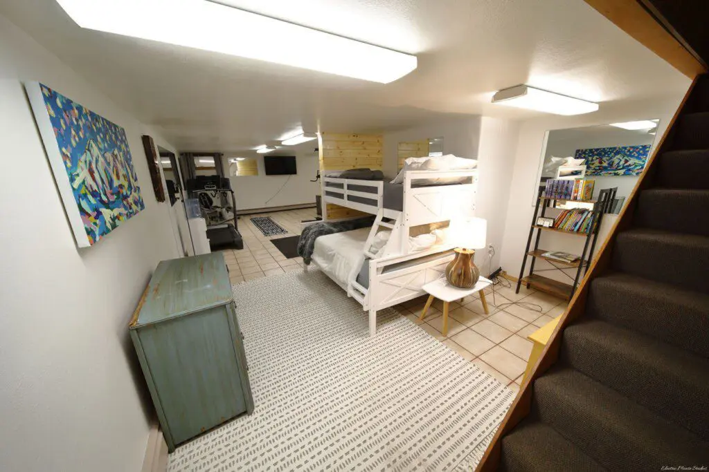 Bunk beds and play area in large family room at Fairbanks adventure lodge in Alaska.
