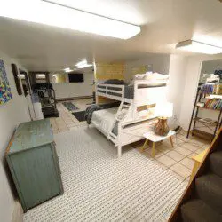 Bunk beds and play area in large family room at Fairbanks adventure lodge in Alaska.