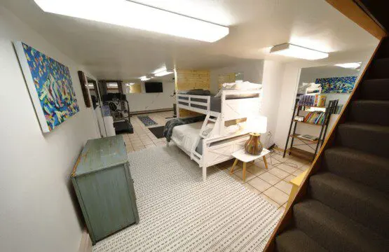 Bunk beds and play area in large family room at Fairbanks adventure lodge in Alaska.