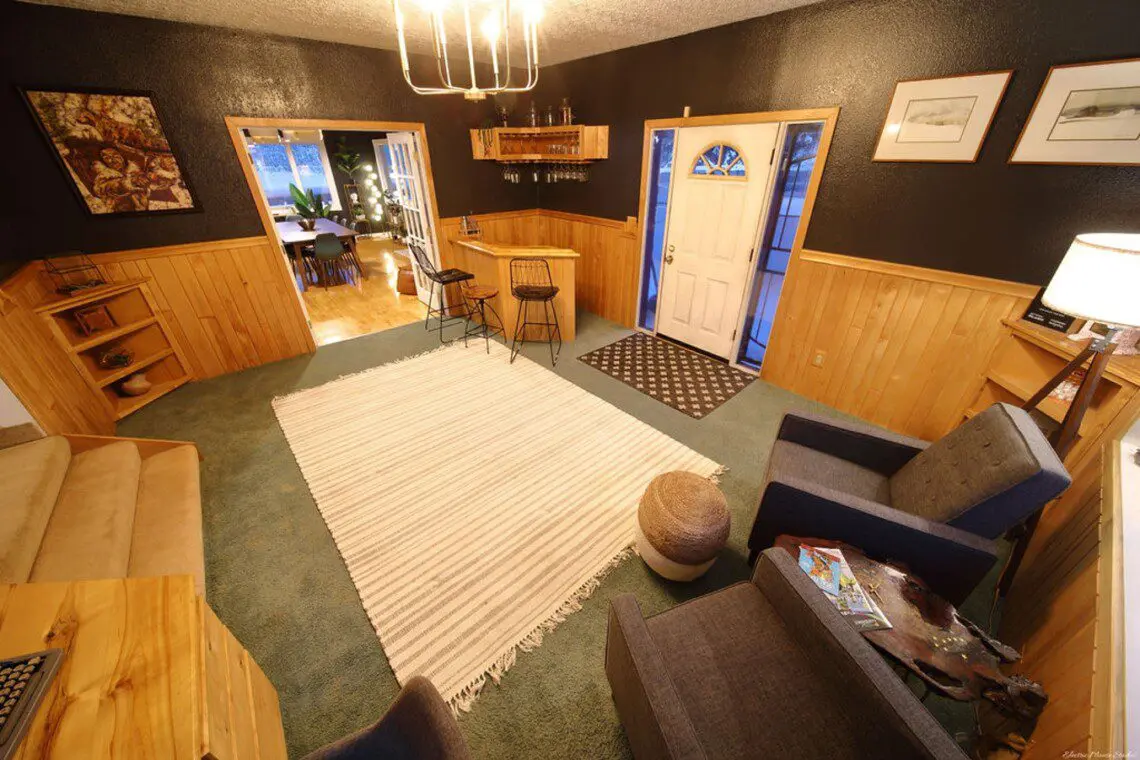 Warm lodge entrance with bar, seating area, and dining room in Fairbanks, Alaska.
