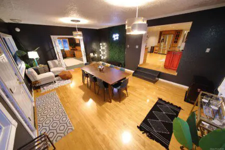 Warm lodge entrance with bar, seating area, and dining room in Fairbanks, Alaska.