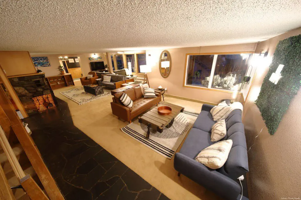 Warm lodge entrance with bar, seating area, and dining room in Fairbanks, Alaska.