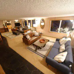 Warm lodge entrance with bar, seating area, and dining room in Fairbanks, Alaska.