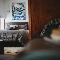 Bedroom and seating area inside restored Alaska railroad lodge in Fairbanks.