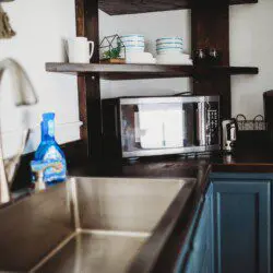 Modern kitchen inside restored railcar at Alaska adventure lodge in Fairbanks.