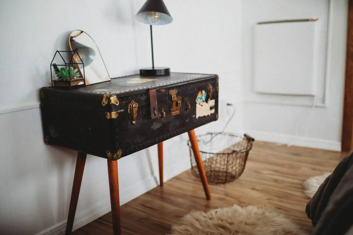 Modern open-plan interior with dining table, ceiling fan, and cozy seating in a Fairbanks Alaska lodge  Caption: