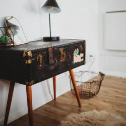 Modern open-plan interior with dining table, ceiling fan, and cozy seating in a Fairbanks Alaska lodge  Caption:
