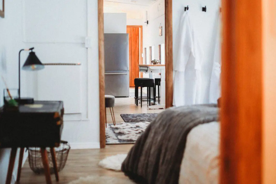 View from bedroom through cozy railcar interior at Alaska adventure lodge in Fairbanks.
