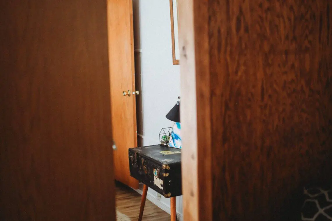 Bedroom and seating area inside restored Alaska railroad lodge in Fairbanks.