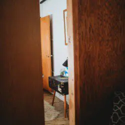 Bedroom and seating area inside restored Alaska railroad lodge in Fairbanks.