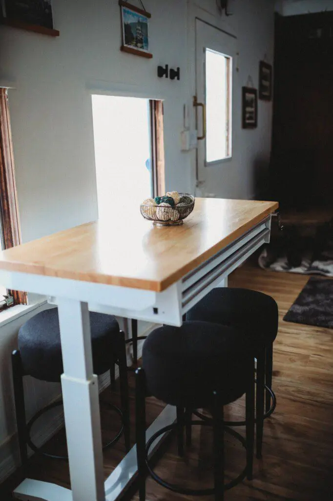 Dining area with windows inside restored railcar lodge in Fairbanks, Alaska.