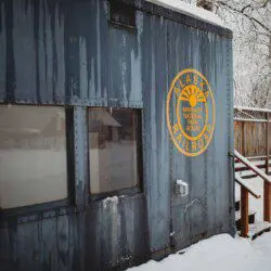 Snow-covered Alaska Railroad car lodge stay in Fairbanks adventure setting.