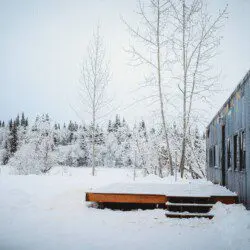 Snow-covered Alaska Railroad car lodge stay in Fairbanks adventure setting.