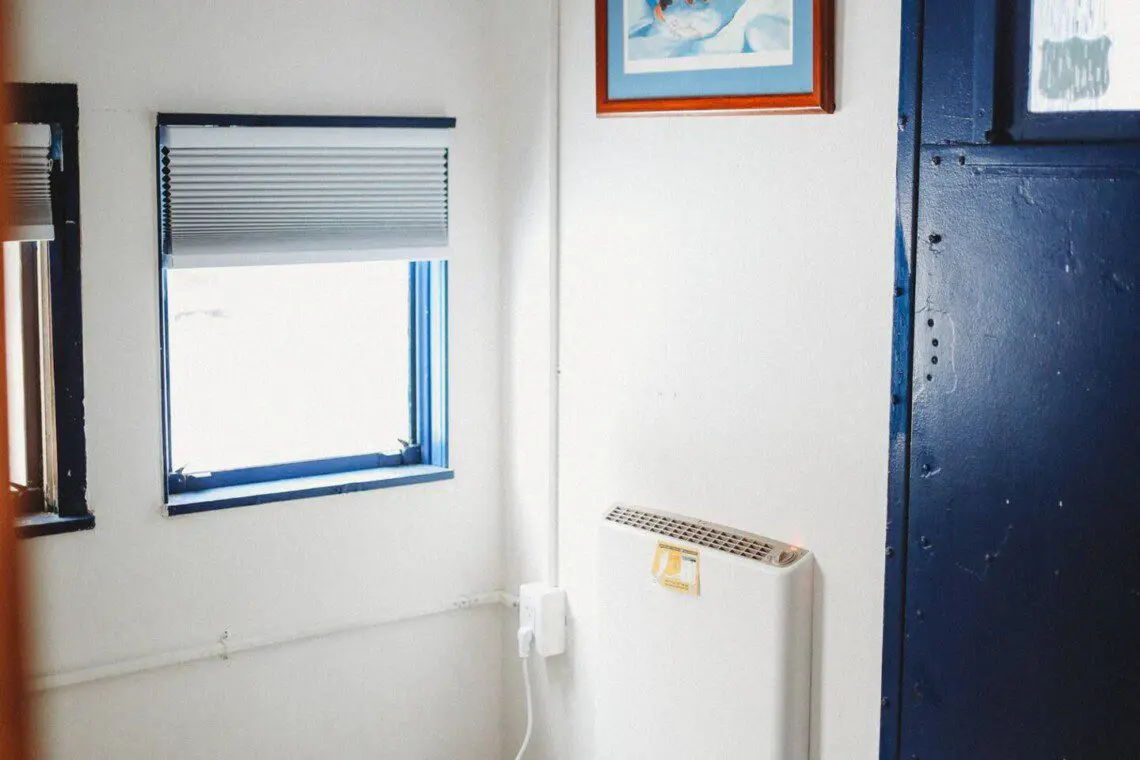 Dining area with windows inside restored railcar lodge in Fairbanks, Alaska.