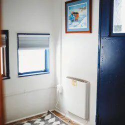 Dining area with windows inside restored railcar lodge in Fairbanks, Alaska.