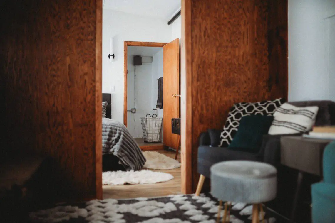 Bedroom and seating area inside restored Alaska railroad lodge in Fairbanks.