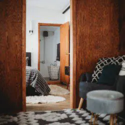 Bedroom and seating area inside restored Alaska railroad lodge in Fairbanks.