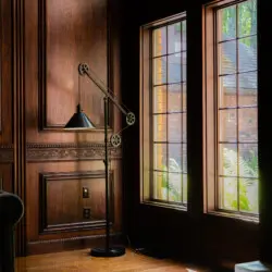 Spacious lodge interior with high ceilings, chandeliers, and large windows in a Fairbanks adventure lodge