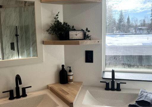 Glass-enclosed shower with marble-style tile in a modern Fairbanks treehouse bathroom