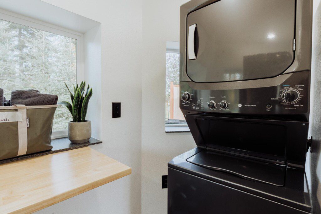 Sleek kitchen with light wood counters, gray cabinets, stainless steel appliances in a Fairbanks Alaska rental