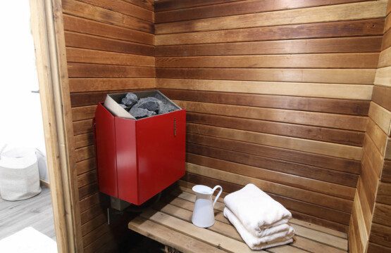 Rustic wood-accented bathroom with white vanity and natural light in Fairbanks Alaska