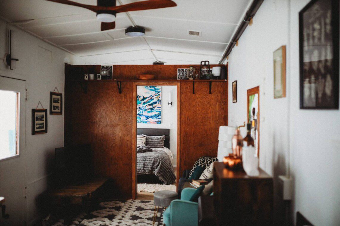 Modern living space inside restored railcar at Alaska adventure lodge in Fairbanks.