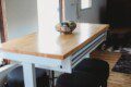 Dining area with windows inside restored railcar lodge in Fairbanks, Alaska.