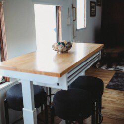 Dining area with windows inside restored railcar lodge in Fairbanks, Alaska.
