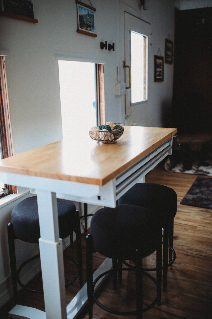 Dining area with windows inside restored railcar lodge in Fairbanks, Alaska.
