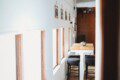 Dining area with windows inside restored railcar lodge in Fairbanks, Alaska.