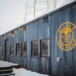 Snow-covered Alaska Railroad car lodge stay in Fairbanks adventure setting.