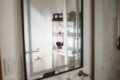 Modern bathroom with mirror and sink inside restored railcar lodge in Fairbanks.